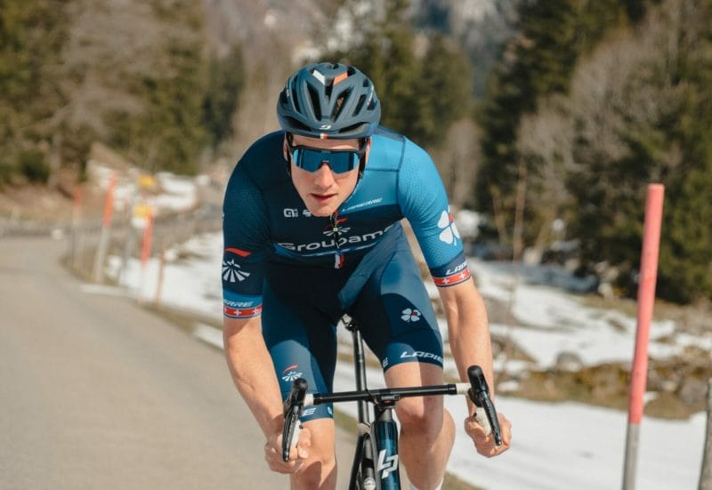 Stefan Kueng biking in action while wearing the React Sunglasses - image for React Products.